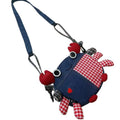 Round denim crab crossbody bag with red gingham patch and button eyes, on white