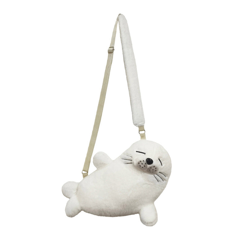 Cream white plush seal crossbody bag with webbing strap, front view