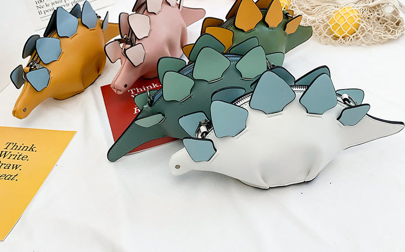Stegosaurus bags in mustard yellow, pink, olive green, teal and white