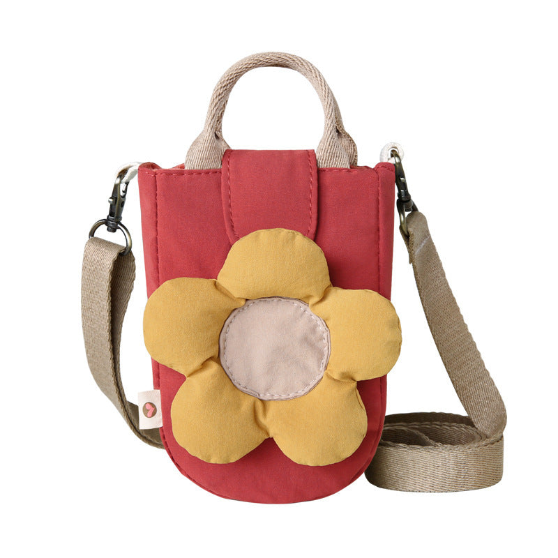 Brick red phone bag with a puffy yellow flower, front view