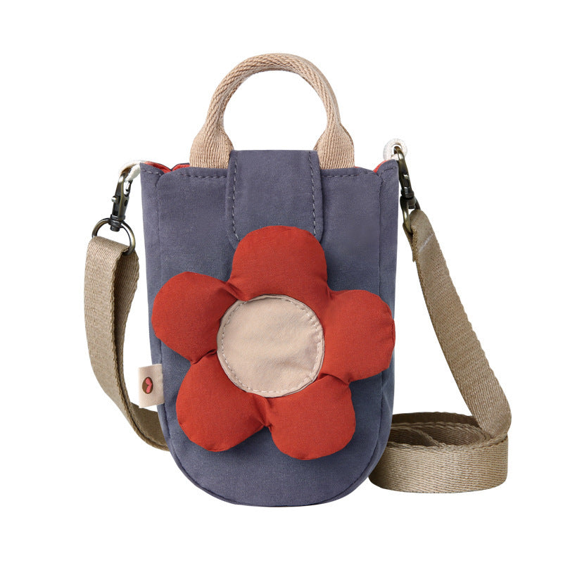 Slate grey phone bag with a puffy red flower, front view