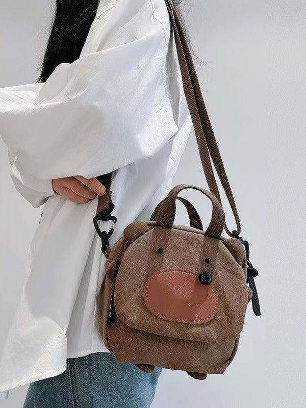 Bear bag hanging from its webbing crossbody strap