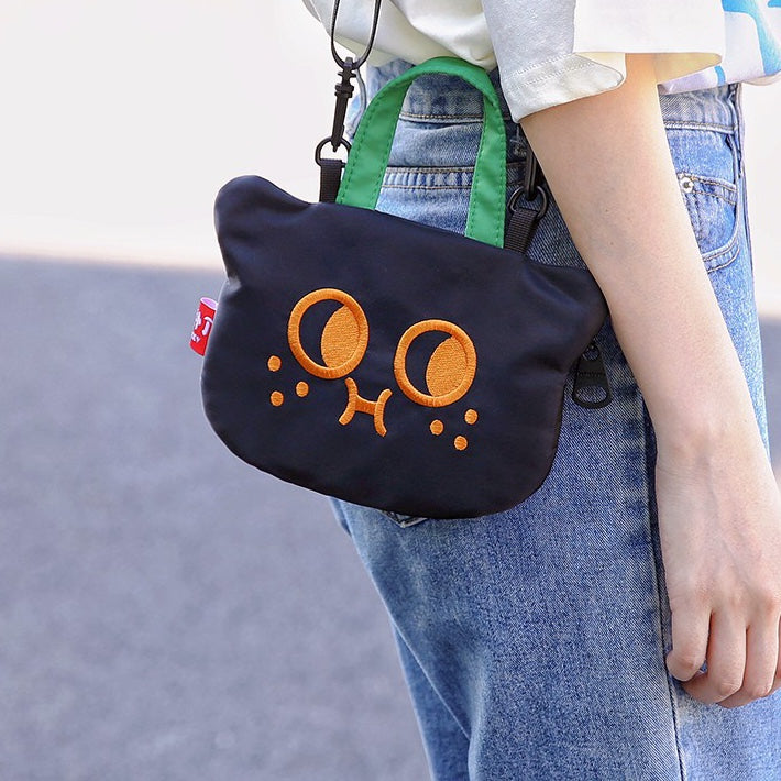 Close view of the cat bag worn at the hip