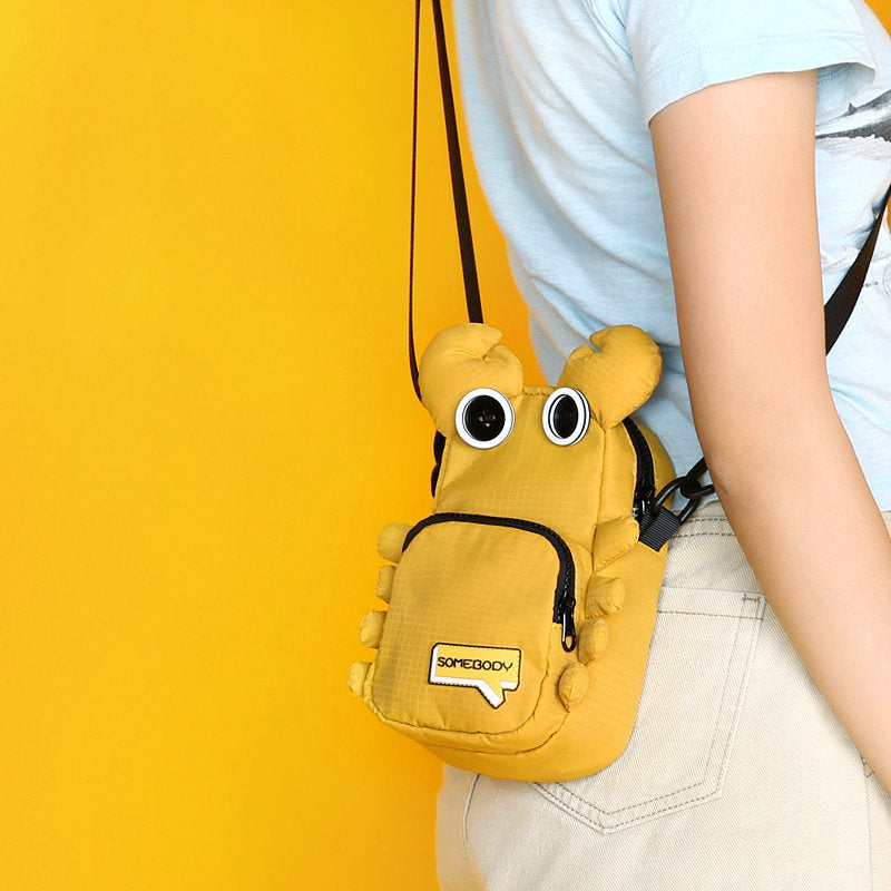 Yellow crab bag worn on the hip, side view