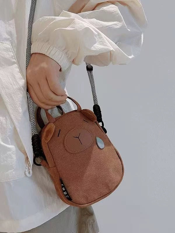 Capybara phone bag carried by its top handles