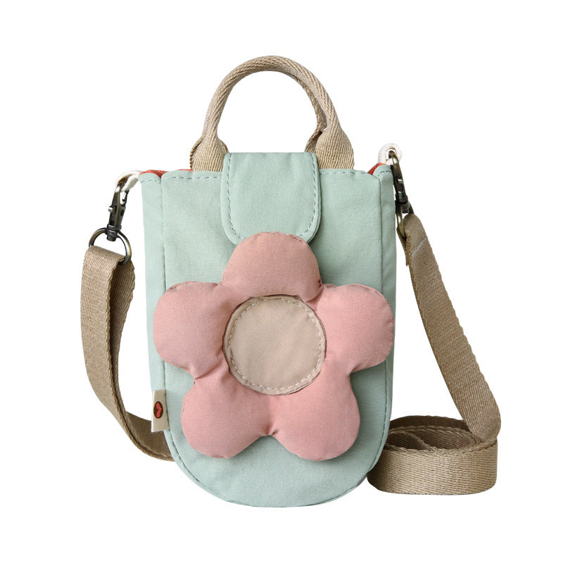 Mint green phone bag with a puffy pink flower, front view