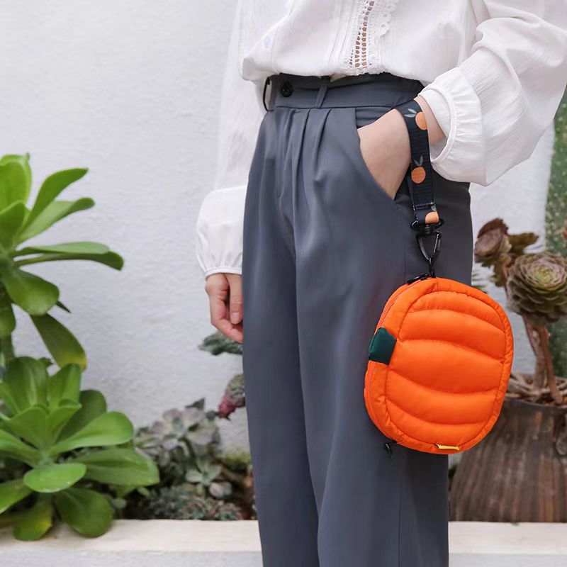 Pumpkin bag hanging from the short wrist loop