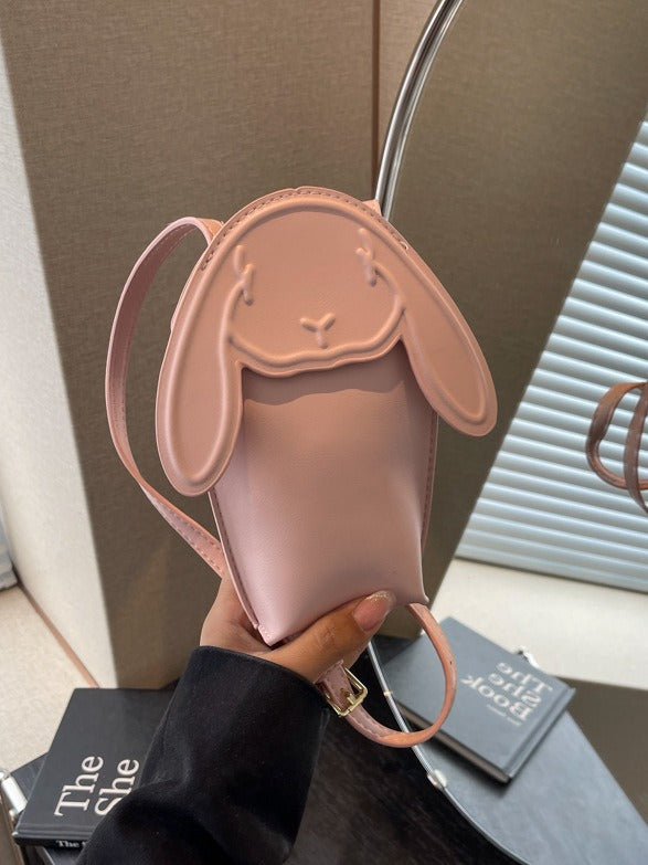 Pink bunny phone bag held in one hand to show its size