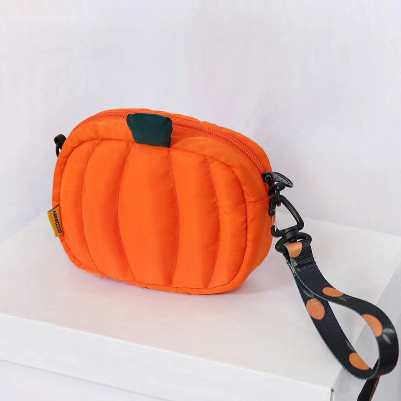 Pumpkin bag from above showing the top zip and strap clip