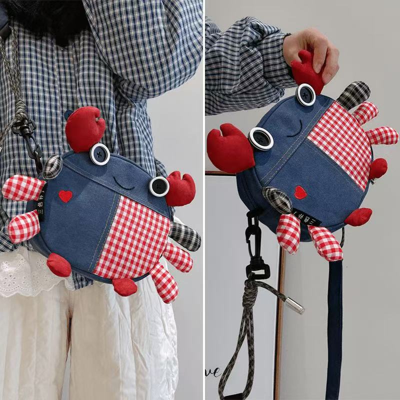 Heart crab bag worn at the hip and held up by one claw