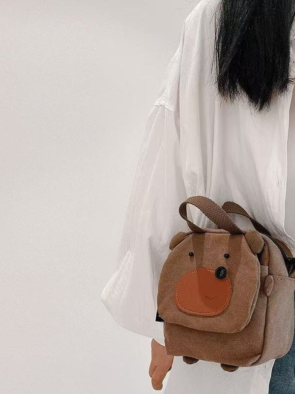 Bear cube bag worn at the hip, side view