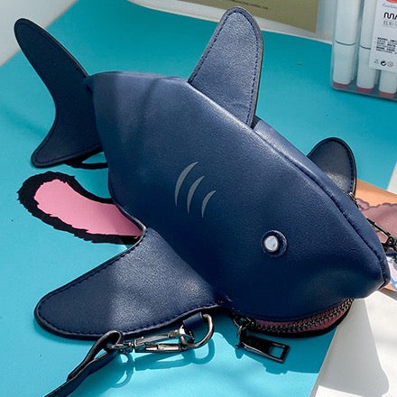 Navy blue shark bag showing the zip mouth and strap clips